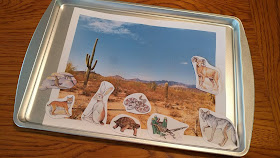 Magnetic animals and matching scene on baking sheet