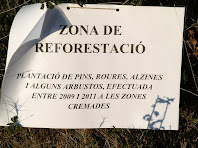 Cartell indicador de la zona de reforestació