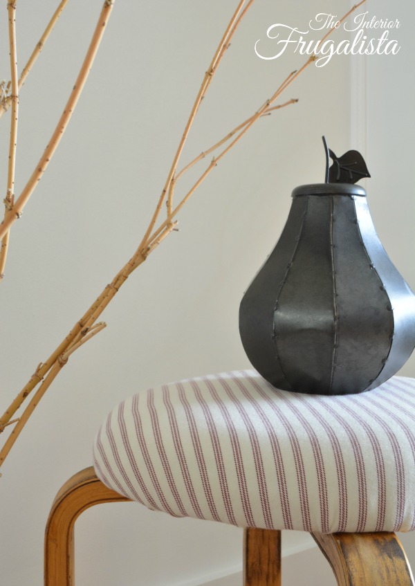 Reupholstering an IKEA Frosta stool with red ticking stripe fabric with farmhouse style.