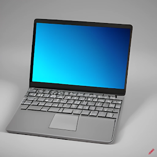 Laptop with blue Windows display showing without any icons and grey keyboard and grey mouse