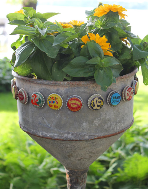 Making over an old farm garden funnel into a colorful planter from Itsy Bits And Pieces blog.