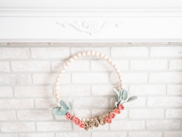 whitewashed faux brick panel wood bead wreath flowers leaves