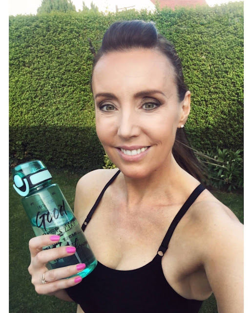 woman fitness with water bottle