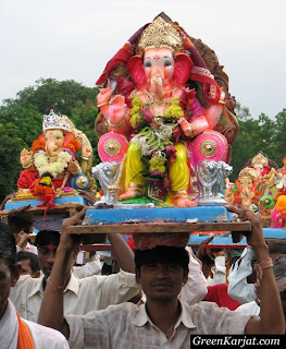 locals carrying Ganesh idols for immersion