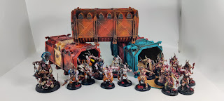 3 warhammer 40k Munitroum Containers surrounded by DeathGuard and Poxwalkers