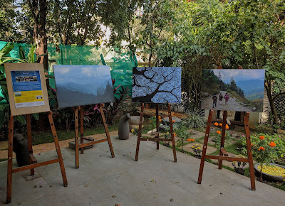 Display of Milind Sathe's pictures on easels at the entrance of Indiaart Gallery