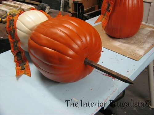 How to prevent outdoor artificial stacked pumpkin topiaries from blowing away in the wind with wooden dowels.