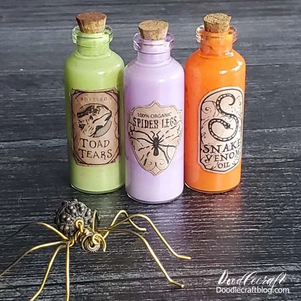 How to Make Mod Podge Halloween Apothecary Bottles!  Learn how to make Mod Podge Apothecary bottles, perfect for Halloween decorations.   Toad tears, snake venom and spider legs!   These are easy to make, can be made with any size bottle and make the perfect spooky decor.
