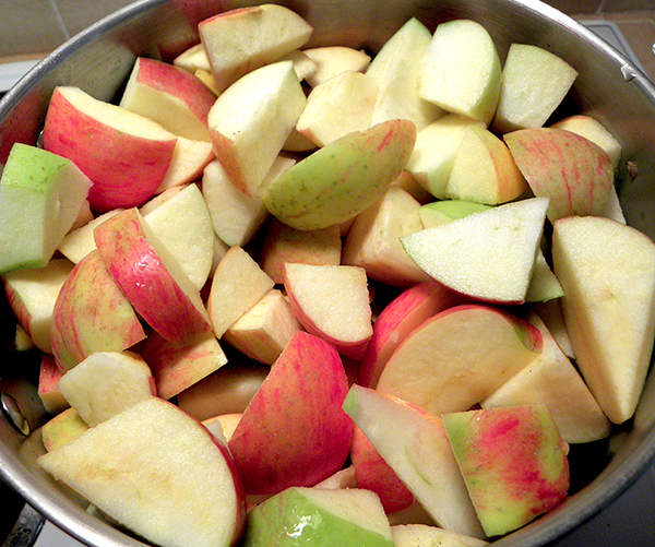 Pot Filled with Apples and Cinnamon Sticks