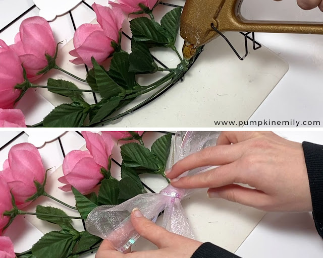 Gluing on a bow over flowers.