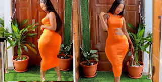 Jenny Yea, Curvaceous model, Shows Off Curves In Orange Body-con Dress