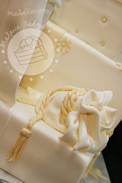 There's a cupcake hidden inside ivory gift packages wedding cake 