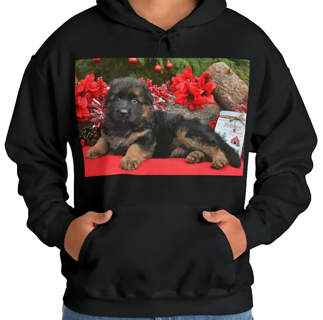 A Hoodie with Cute German Shepherd Puppy With Floppy Ears Lying on a Place Decorated for Christmas