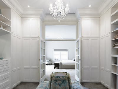 Appealing Walk In Closet with White Shelves, White Drawers and Beautiful Chandelier in Project Canny Sackville