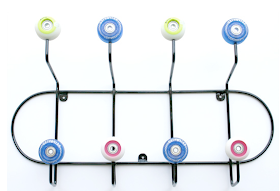 wall-mounted coat hanger made with skateboard wheels