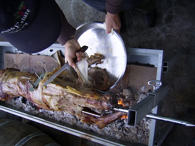 Carving lamb on a spit
