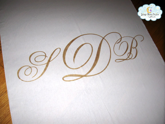 Gold Monogram Aisle runner Sheila wanted a classic monogram painted on the 