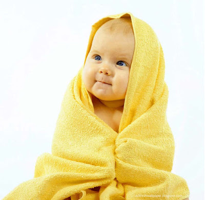 sweet-cutest-baby-wearing-yellow-color-towel-sitting