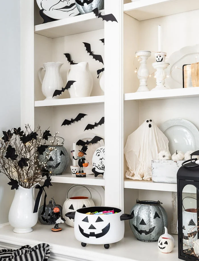 white bookshelves, jack o lanterns, ghost, bats, spooky tree
