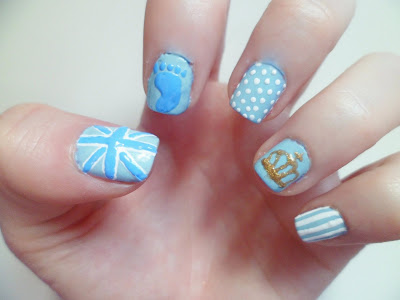 A close up image of nail art inspired by the birth of the royal baby