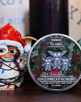 Photograph of one of Rinkydink candles, with a Christmas themed Gizmo from The Gremlins.