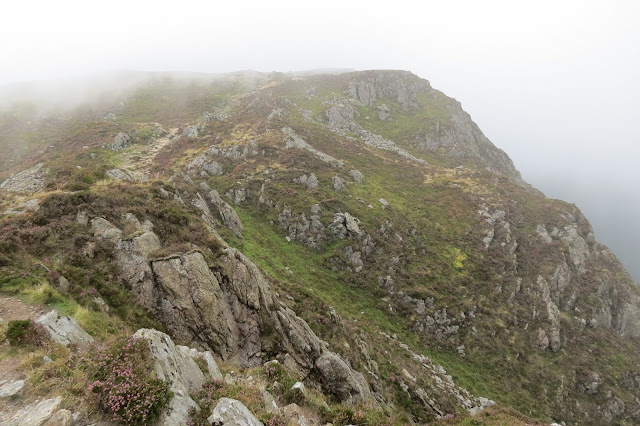 A narrow path running above steep crags.