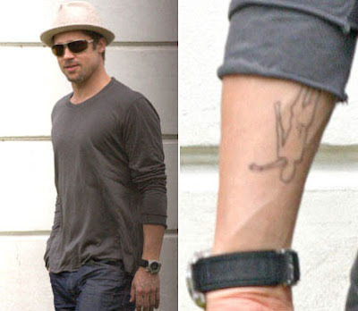 brad pitt tattoo. Tattoos: Brad Pitt flaunts his