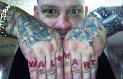 Guy with Wal-Mart knuckle tattoos