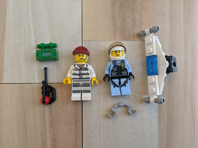 The 2 Minifigures depicted alongside the accessories included with this set