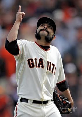 an Francisco Giants' Sergio Romo walks off the field during his MLB National League baseball game against the St. Louis Cardinals in San Francisco, California, April 8, 2011.   REUTERS/Beck Diefenbach