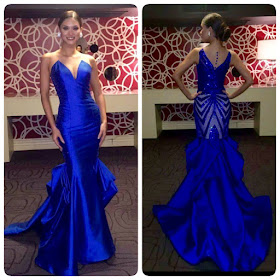 Miss Universe 2015 Pia Wurtzbach wears a blue gown by Filipino designer Albert Andrada
