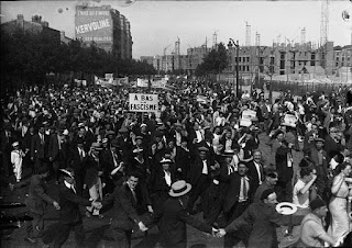 1934 demonstration in Paris, with a sign "Down with fascism"