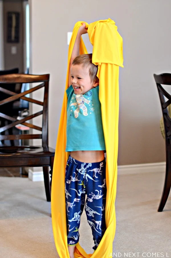 Playing with a homemade sensory tunnel