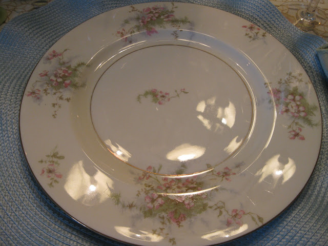 My plates have cream and green with pink apple blosson 39s