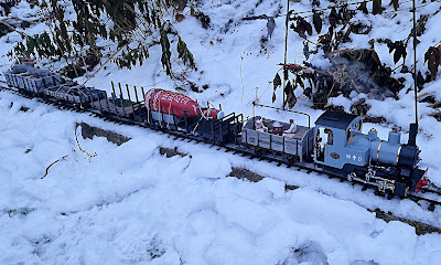 Running G-scale trains in the garden during winter. Running G-scale trains in the snow. G-scale Heeresfeldbahn