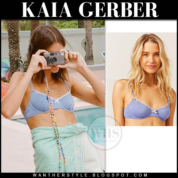 Kaia Gerber in blue bikini top and green towel