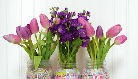 pink and purple tulips in Mason jar vases