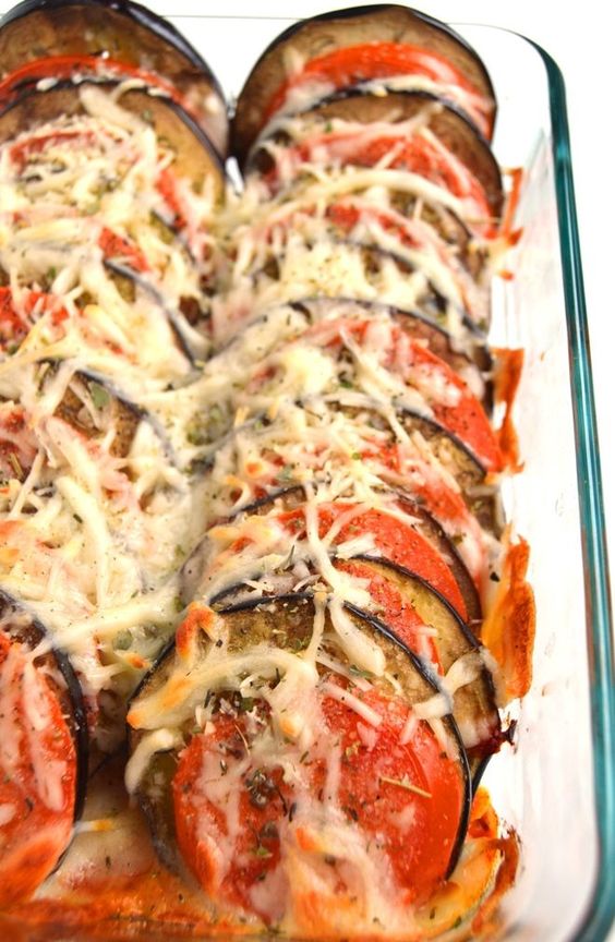 Layered Eggplant Parmesan is a healthier and simpler take on the traditional recipe with stacked tomatoes and eggplant baked with Parmesan and mozzarella cheese, garlic and Italian spices!