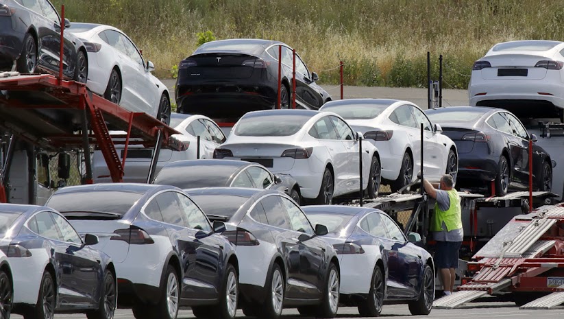 Tesla cars are loaded onto carriers at the Tesla electric car plant in Fremont, Calif., in this May 13, 2020, file photo. California expects electric vehicle sales to triple in the next four years, reaching 35% of all new car purchases. Regulations passed by the California Air Resources Board on Tuesday, April 12, 2022, lay out a plan for the state to meet California Gov. Gavin Newsom's ambitious goal of phasing out the sale of new gas-powered cars. The draft must go through a months-long state regulatory process before it can be approved by the US EPA.