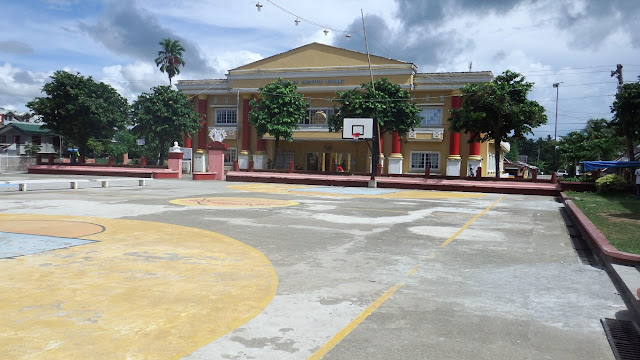 Pambuhan Municipal Auditorium with the Executive Building in the background