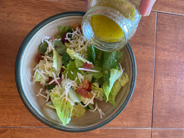 salad in bowl with dressing