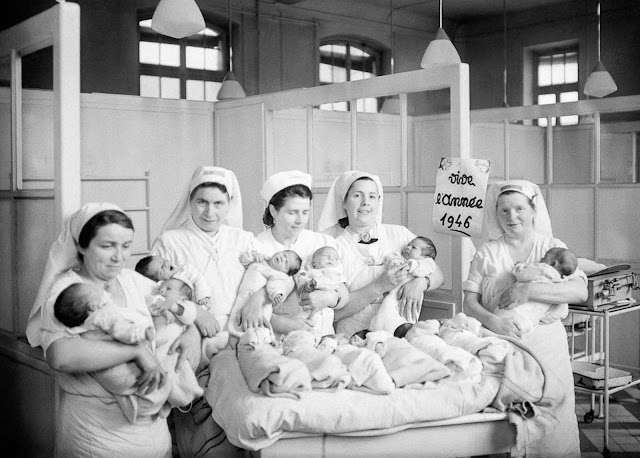 Nurses with newborns at a hospital in Paris, 1946.