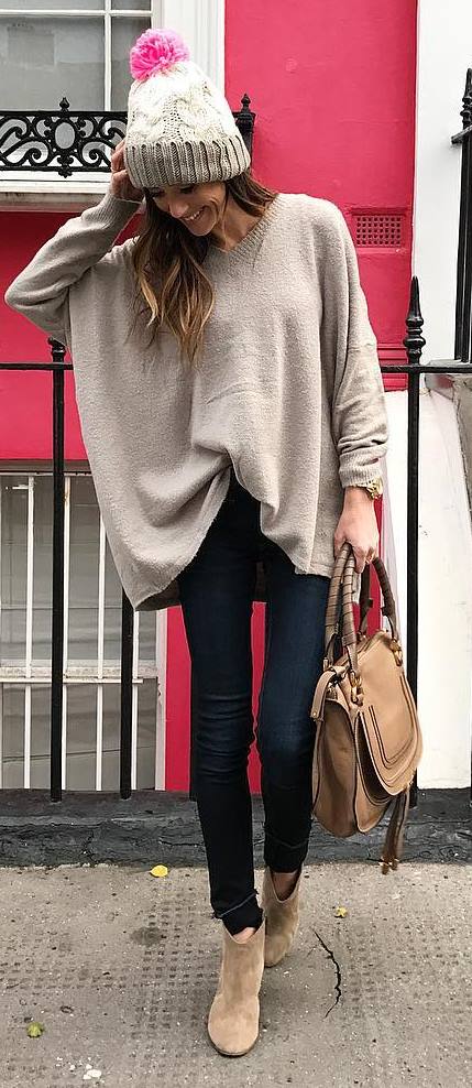 what to wear with a nude poncho : knit hat + bag + skinny jeans + boots