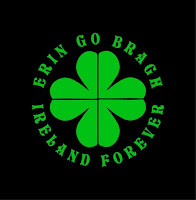A green sharmrock on a black background with the words, "Erin Go Bragh Ireland Forever" in green surrounding the shamrock.