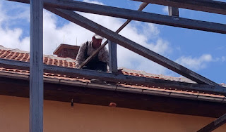 Bekir removes tiles and knocks through