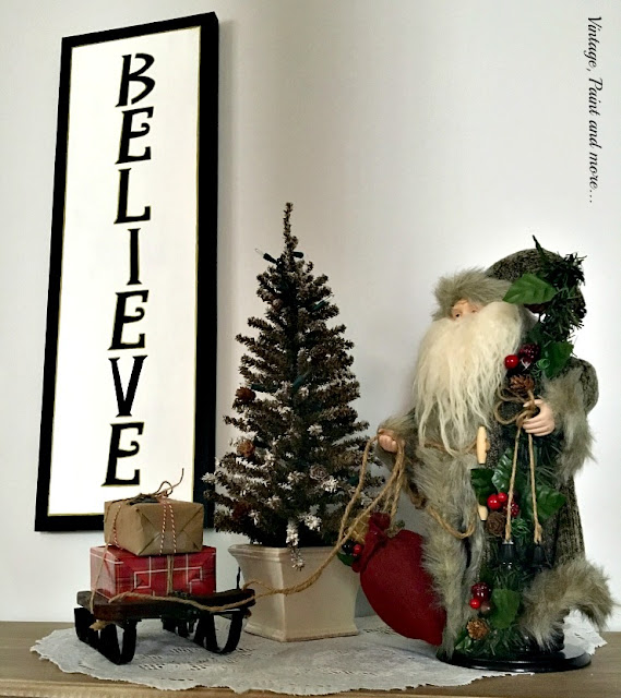  DIY BELIEVE sign done on recycled canvas, vintage sleigh with faux packages, Santa and mini tree