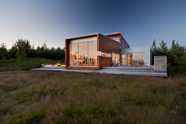 Modern house surrounded by the green hills