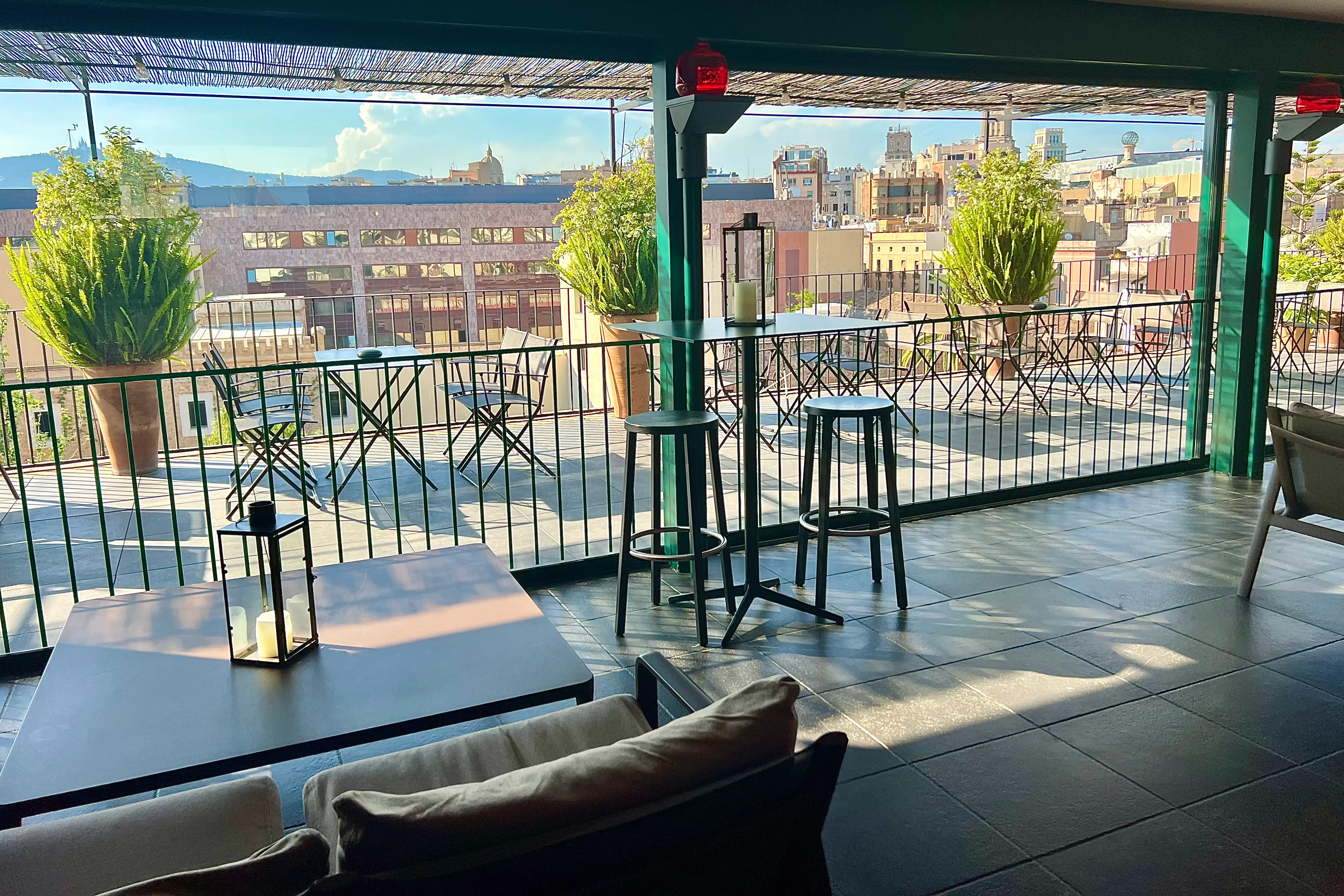 view from the honesty bar area to the terrace and raval area of barcelona at casa camper hotel