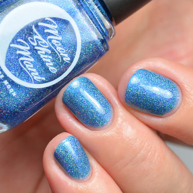 blue nail polish with shimmer in a bottle