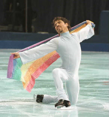 Photograph of U.S. Figure Skating holding a Pride flag and skating to "Over The Rainbow"